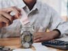 Emergency Fund: How Much Should You Save? Emergency savings fund planned with a calculator and financial documents