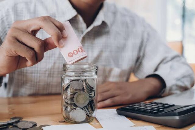 Emergency savings concept with money, calculator and financial plan Emergency savings fund planned with a calculator and financial documents